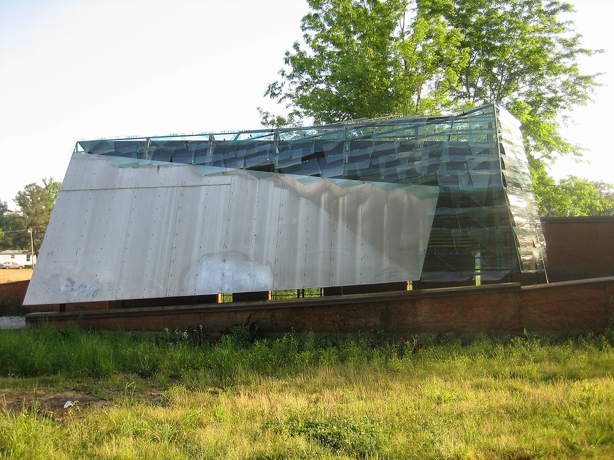 KATRINA - Year 2000 design the Glass Chapel serves as a transportation hub, community space, chapel for the local choral group, and distribution center for children’s summer school meals.
