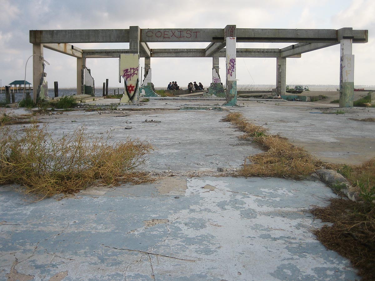 KATRINA - Coexist. Abandoned concrete structure at Gulf shoreline.